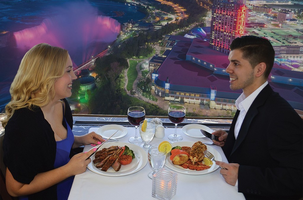 couple on a date at skylon tower with a view of niagara falls