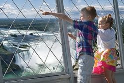 Two small kids enjoying the view from the observation deck at Skylon Tower